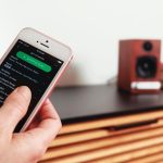 Which mobile app is used for controlling the audio system?