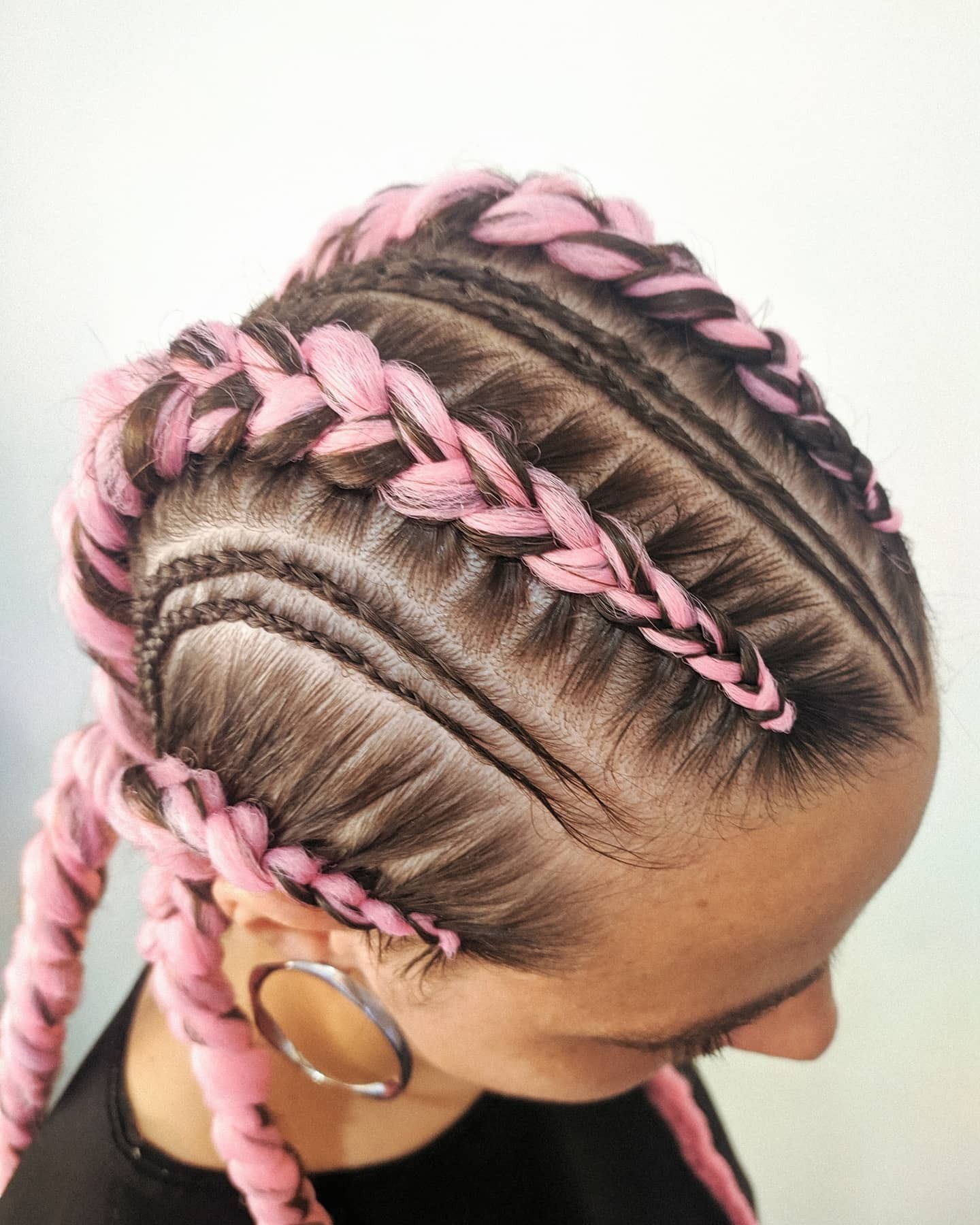 The Whimsical Charm of Pastel Pink Braids