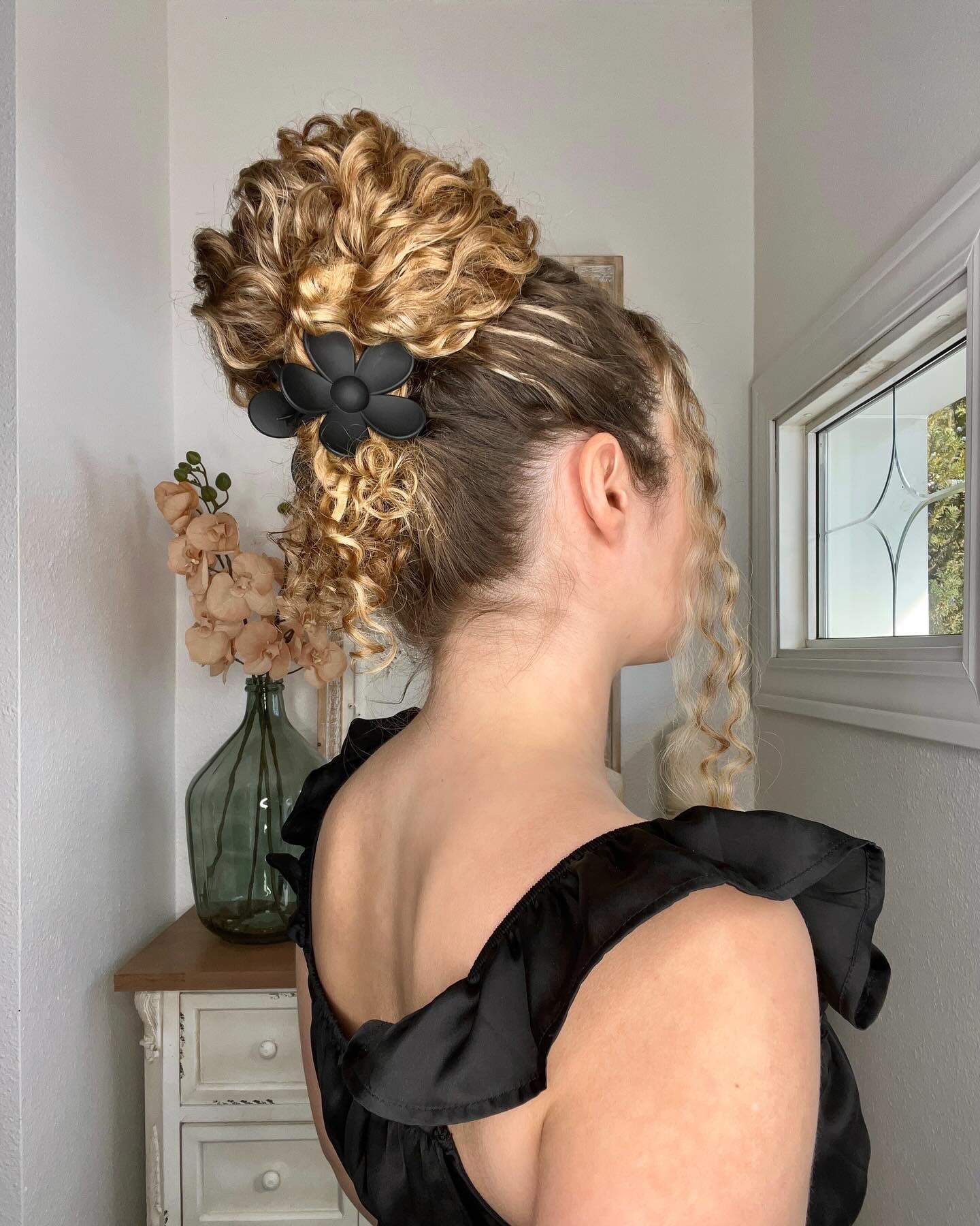 Curly High Bun with Decorative Clip