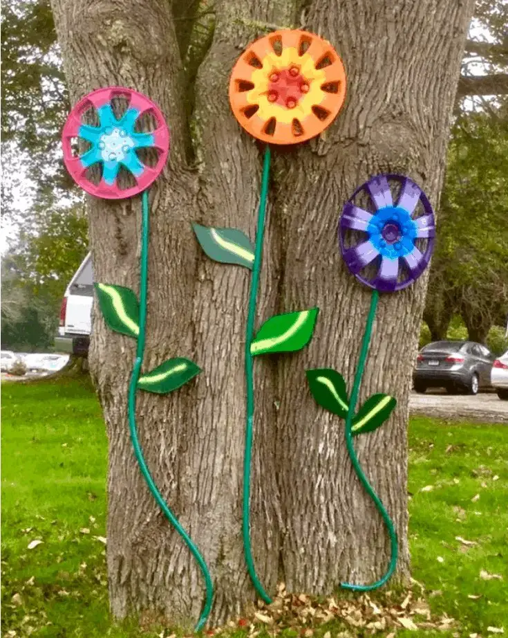 Forming Flowers from Hubcaps and Hose