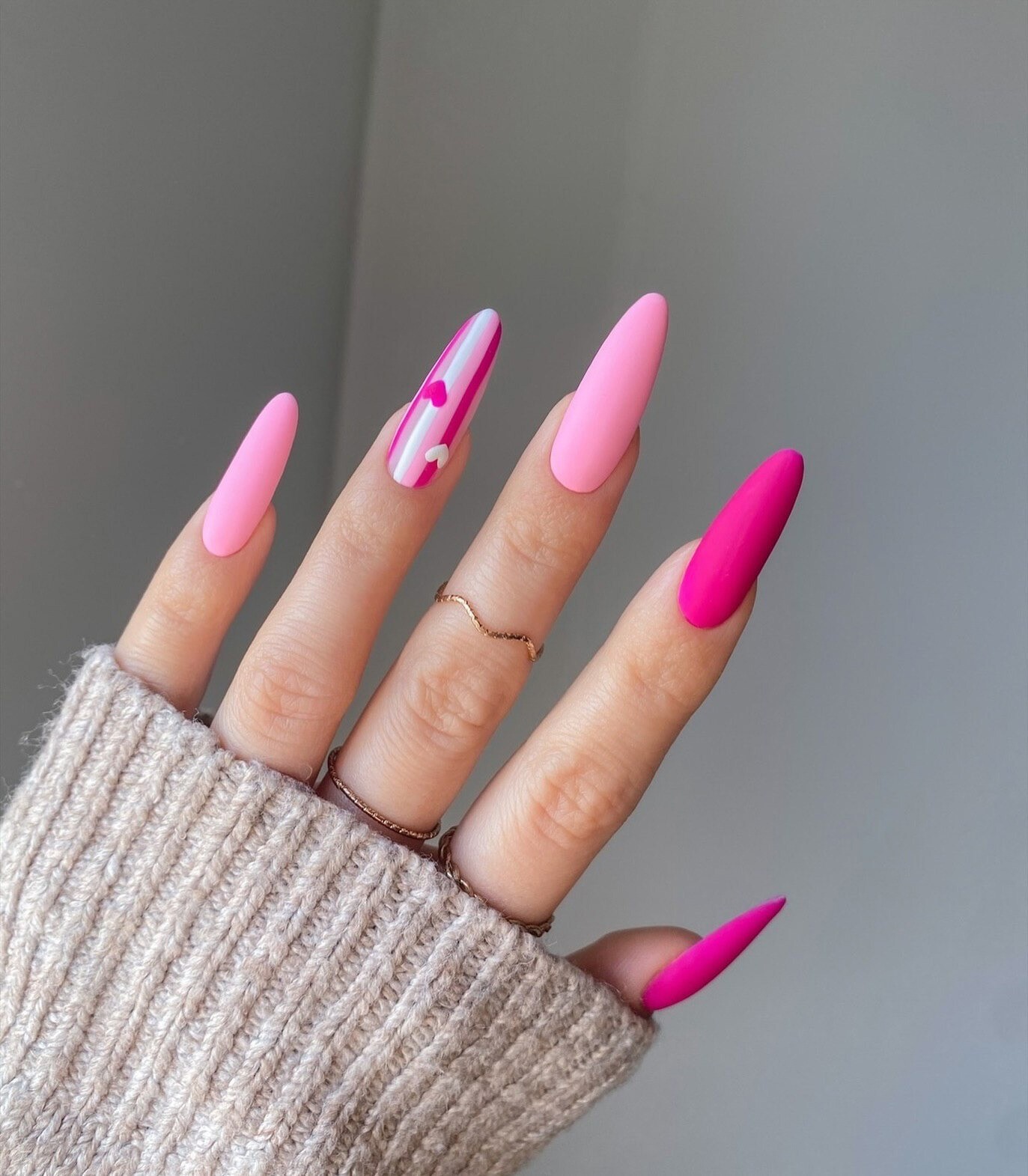 Sophisticated Pink Almond Nails with Modern Art