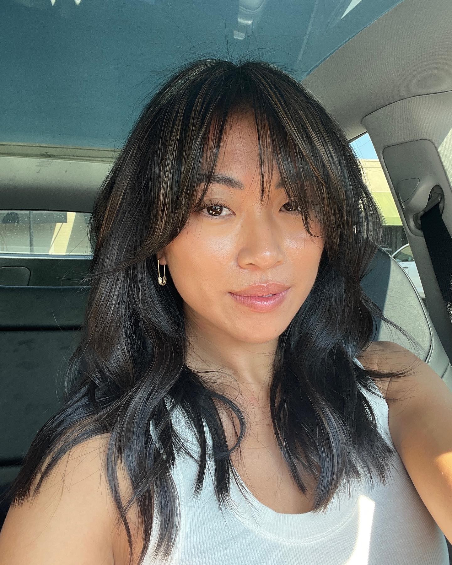 Sunkissed Highlights and Side-Swept Bangs