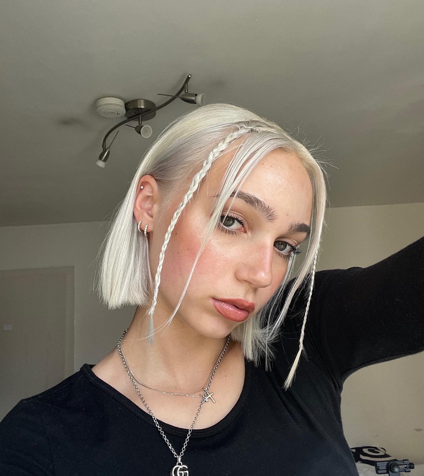 Edgy Platinum Bob with Braided Accents