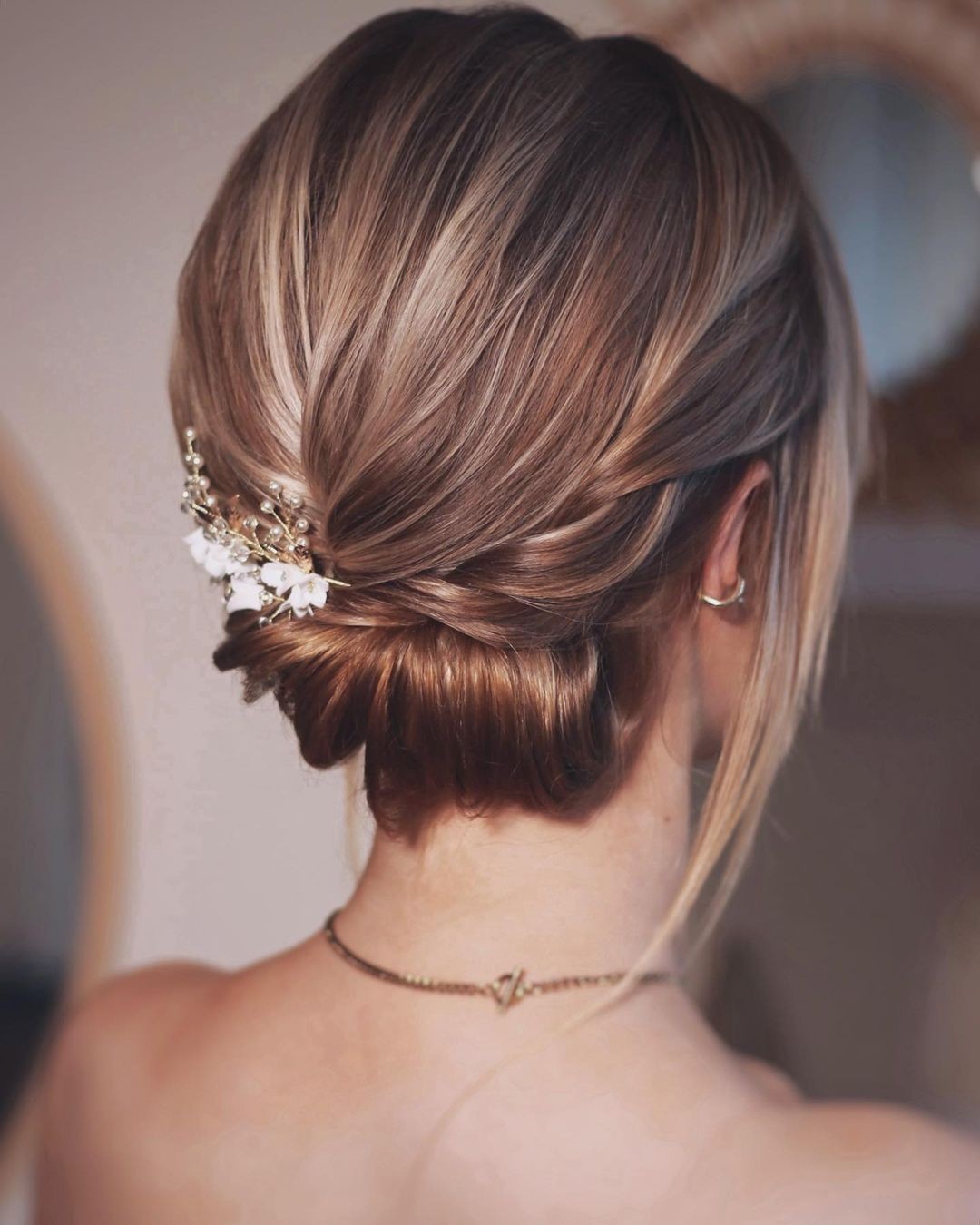 Twisted Low Bun with Floral Elegance