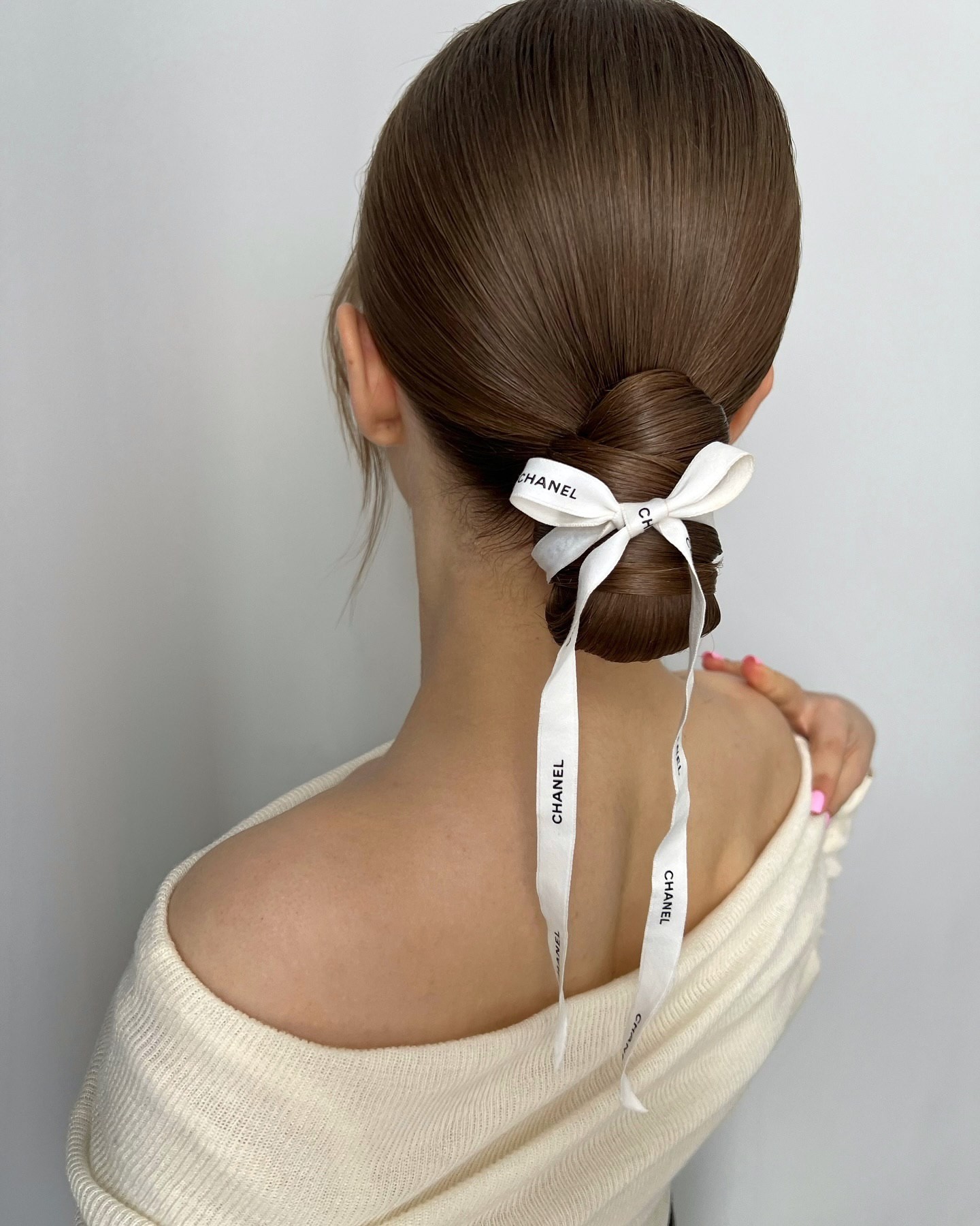 Sleek Low Ponytail with Designer Accessory