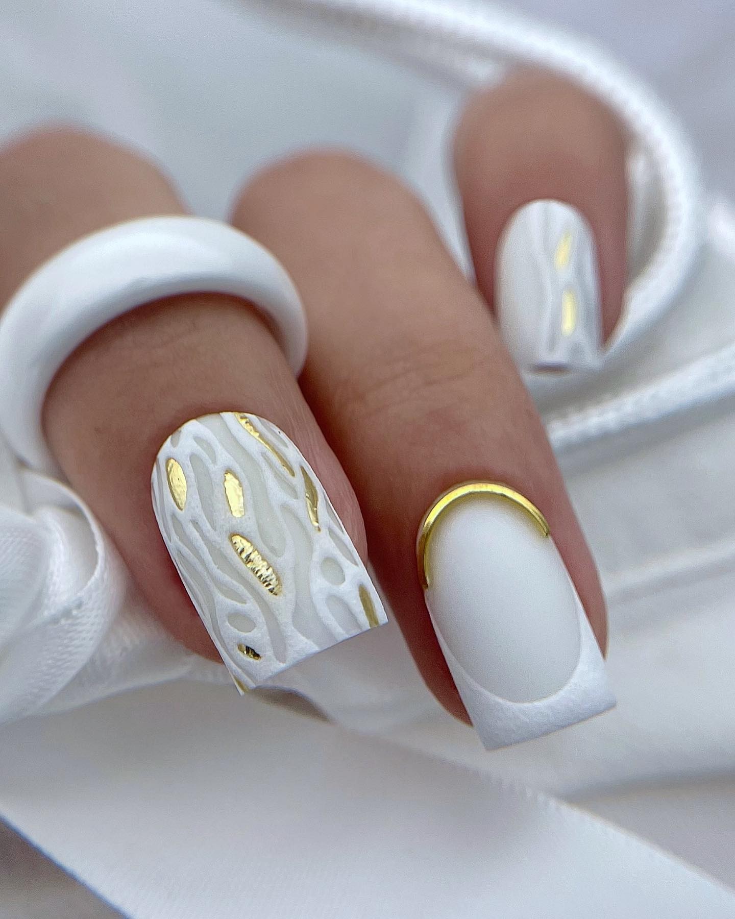 Elegant White Nails with Gold Accents