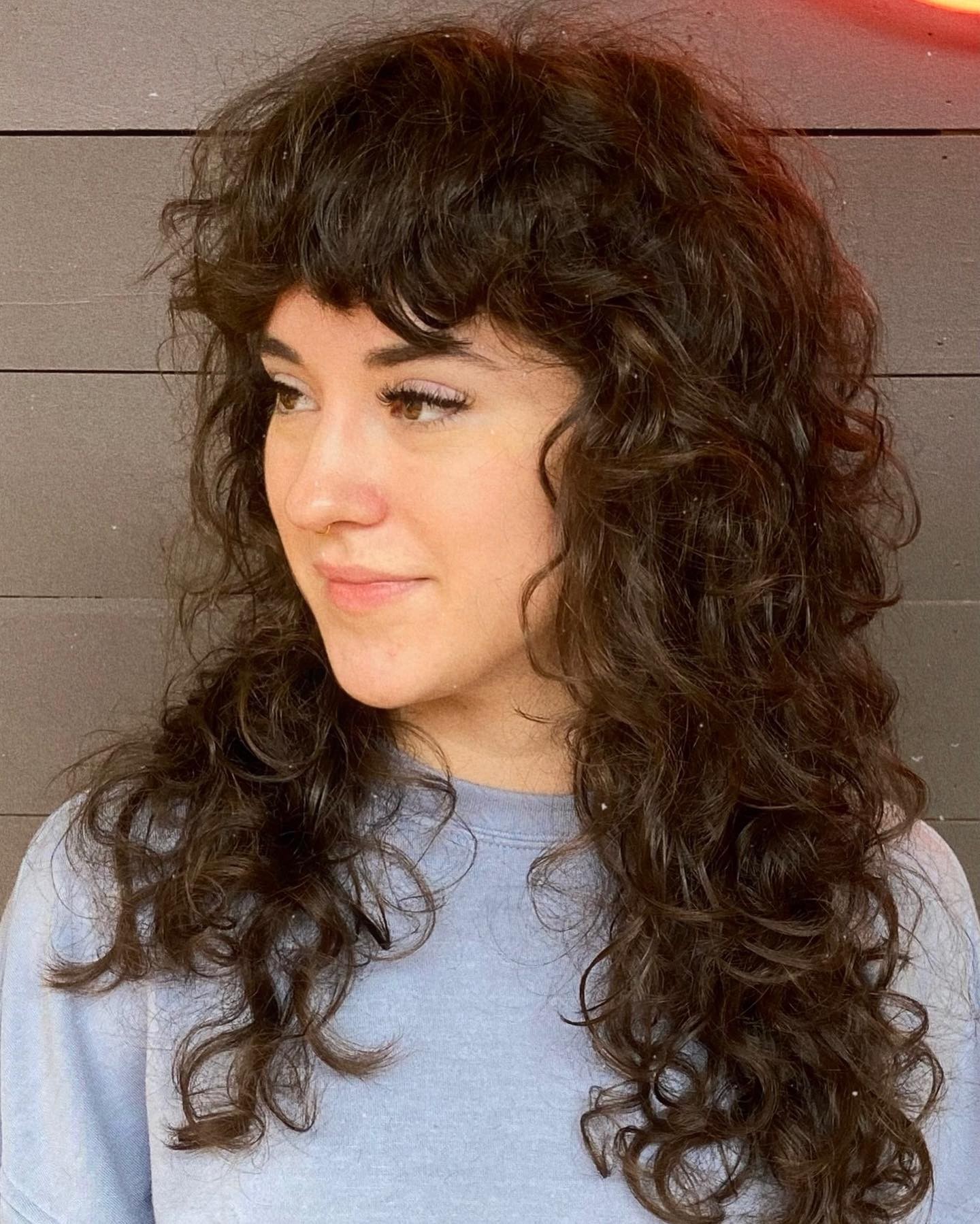 The Contemporary Curly Shag With Side Swept Bangs