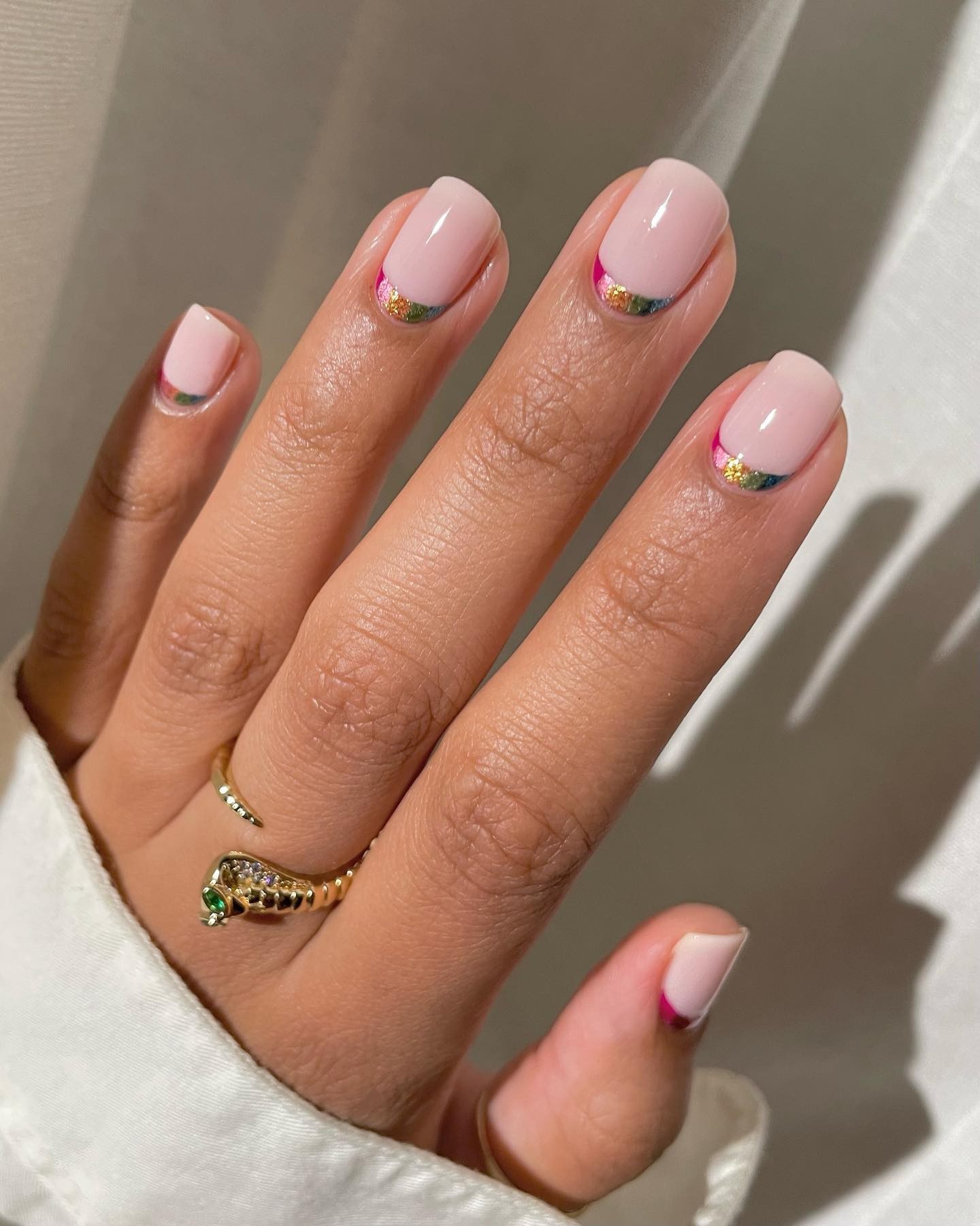 Refined Radiance: Pink Polish with a Golden Edge