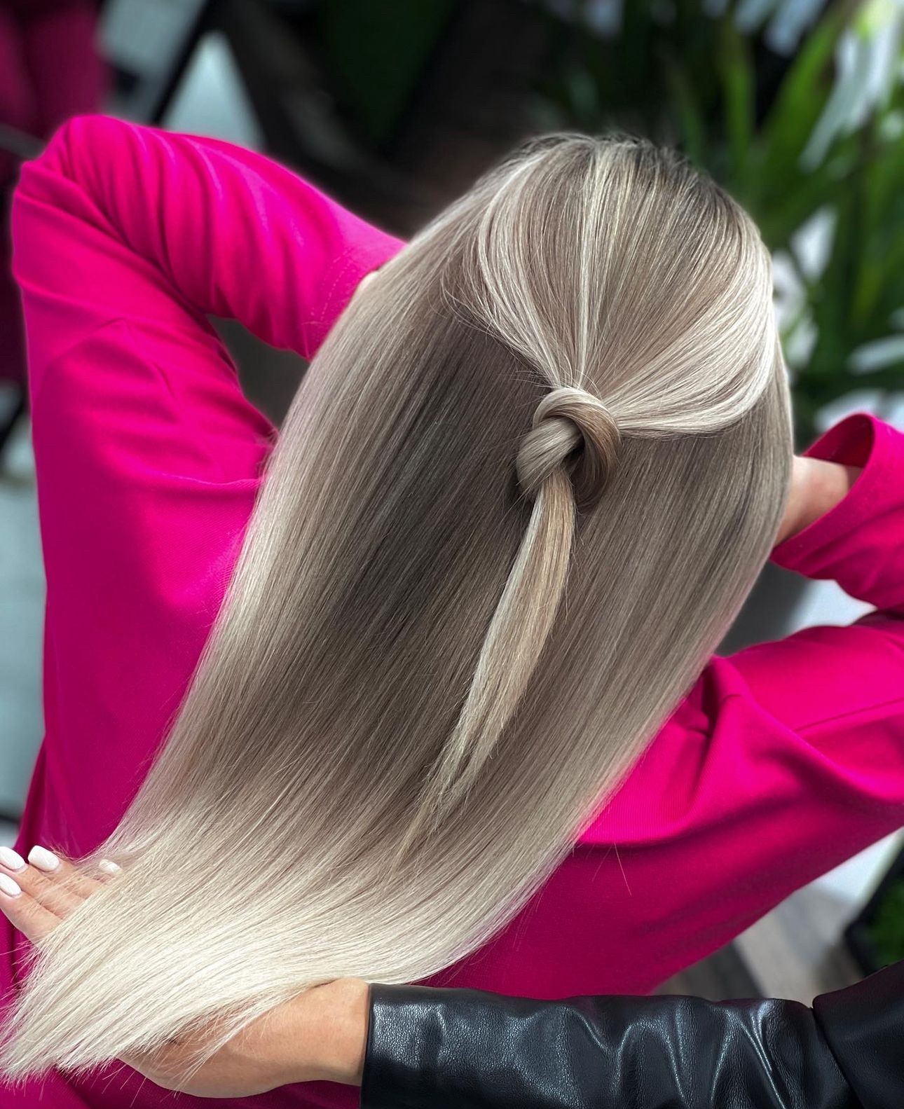 Sleek Blonde with Knotted Half-Up Style