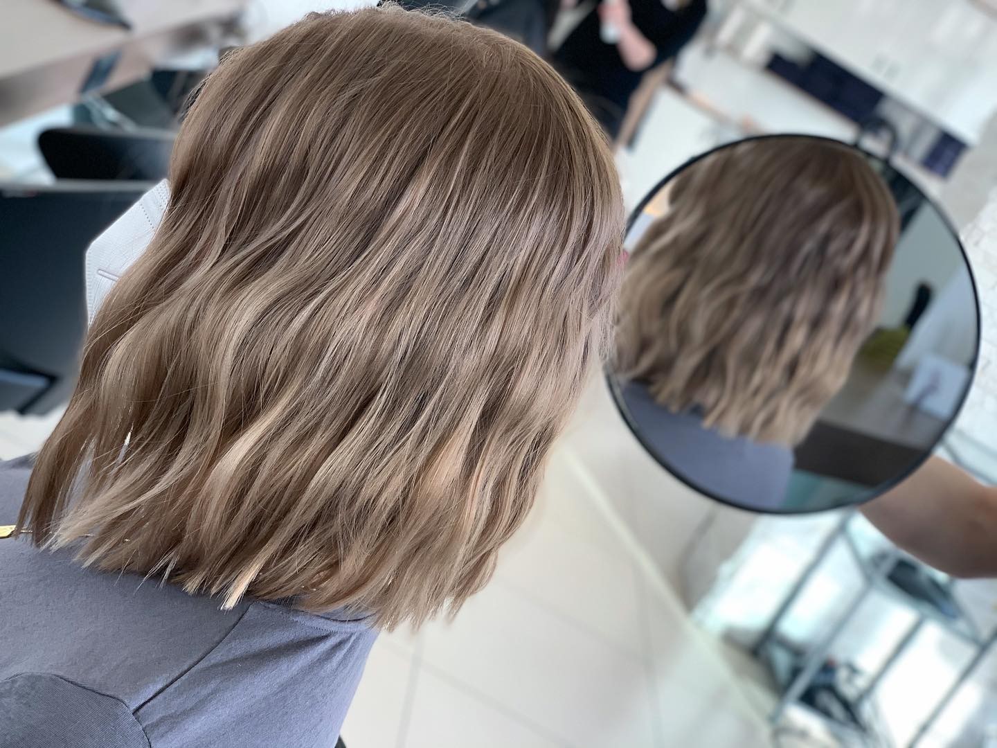 Short and Sweet: The Playful Bounce of Dark Blonde Bob