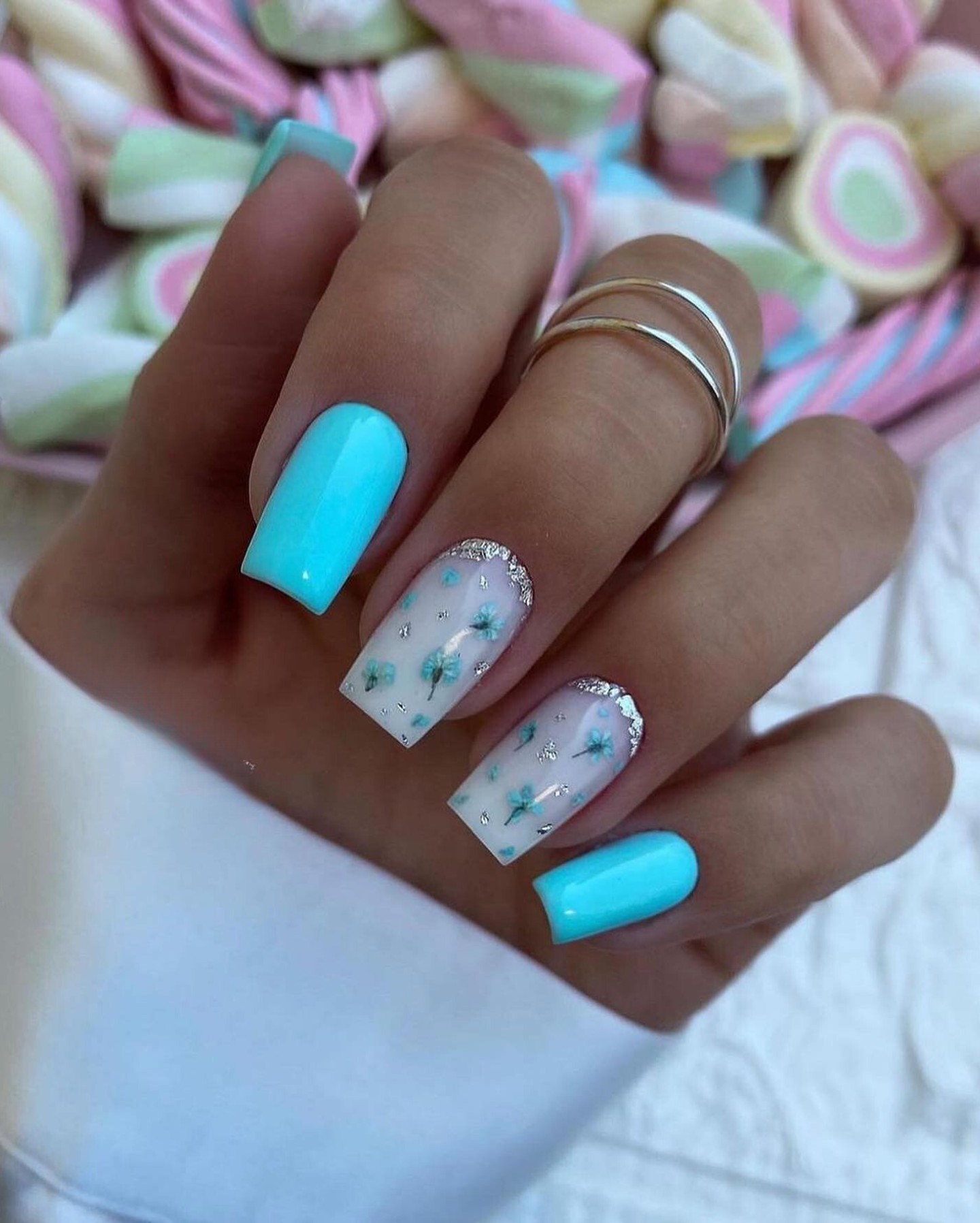 Vibrant Turquoise Nails with Floral Accents