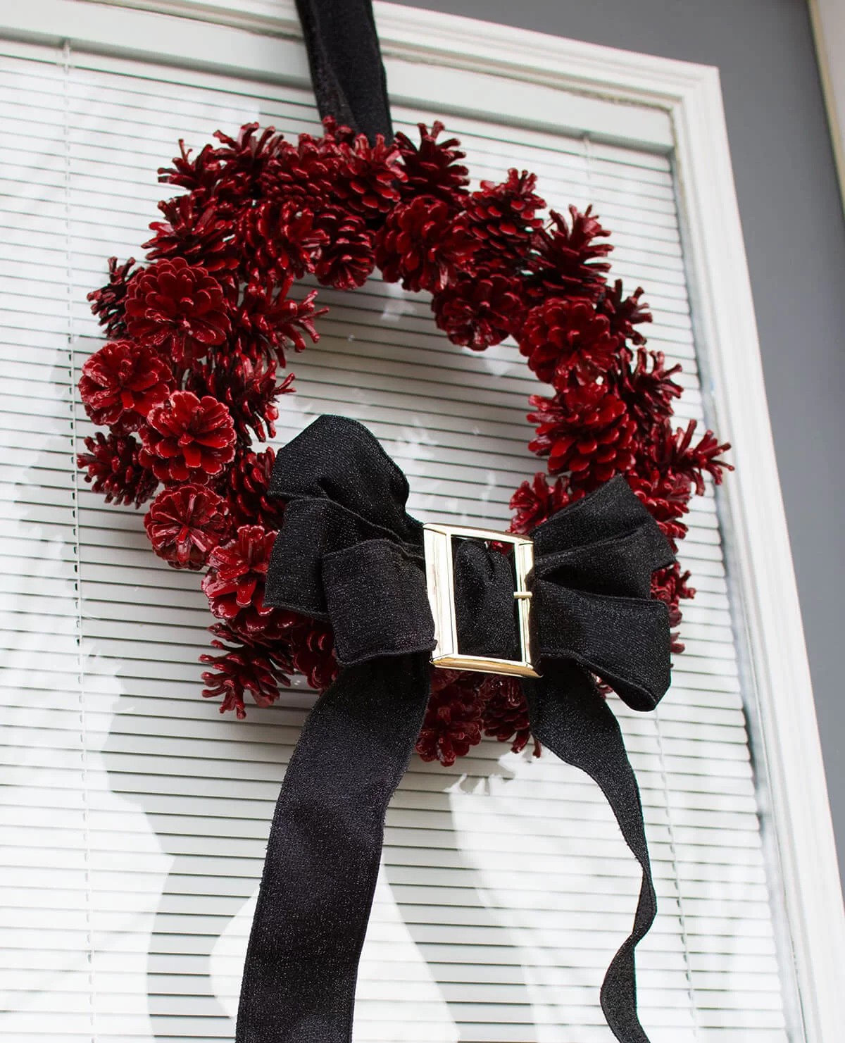 Santa’s Belt Pine Cone Wreath