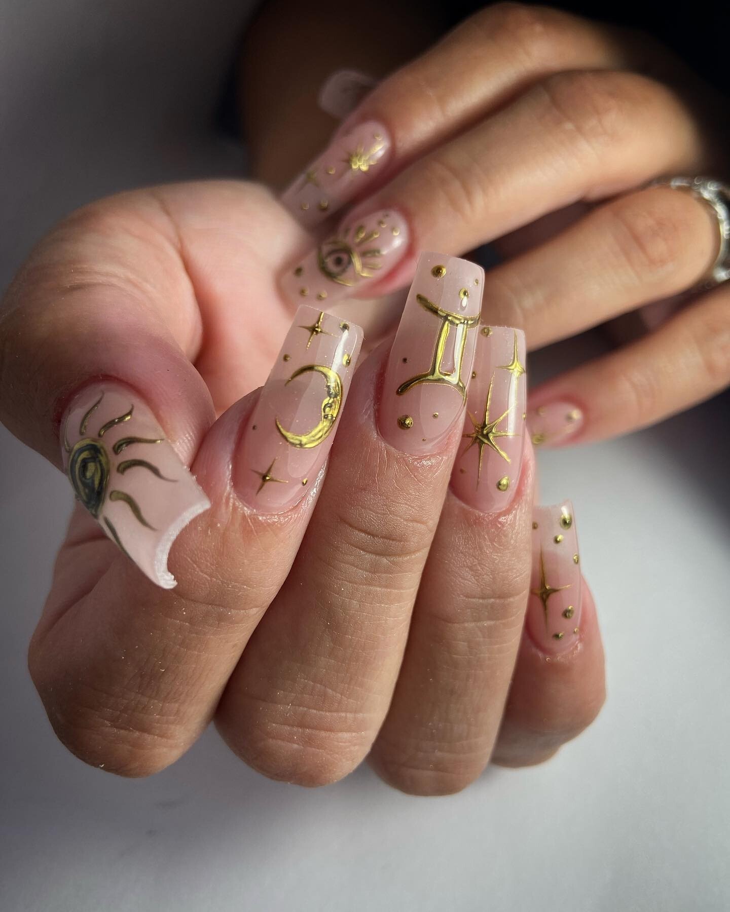 Celestial Elegance: Soft Pink and Gilded Details