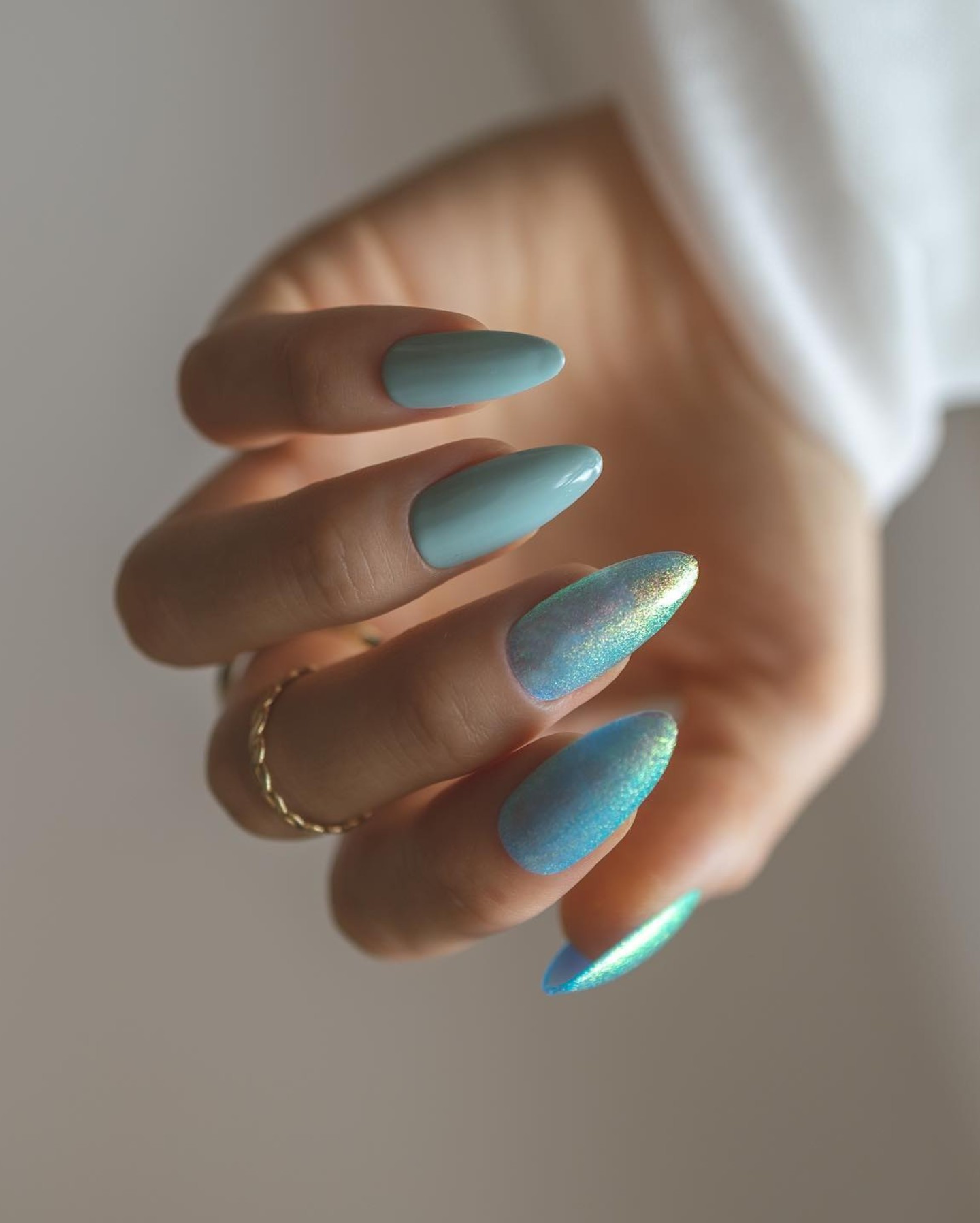 Glossy Blue Nails with Holographic Accent