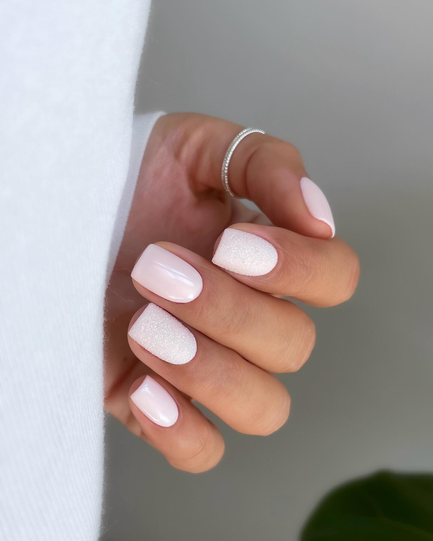 Subtle White Nails with Textured Accent