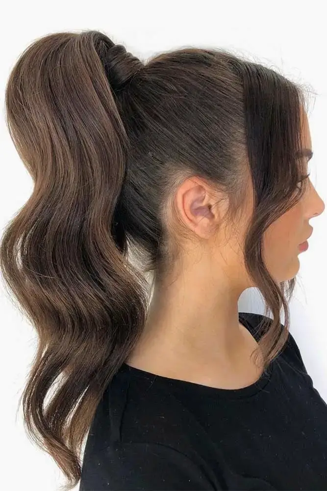 Sleek High Ponytail with Loose Waves