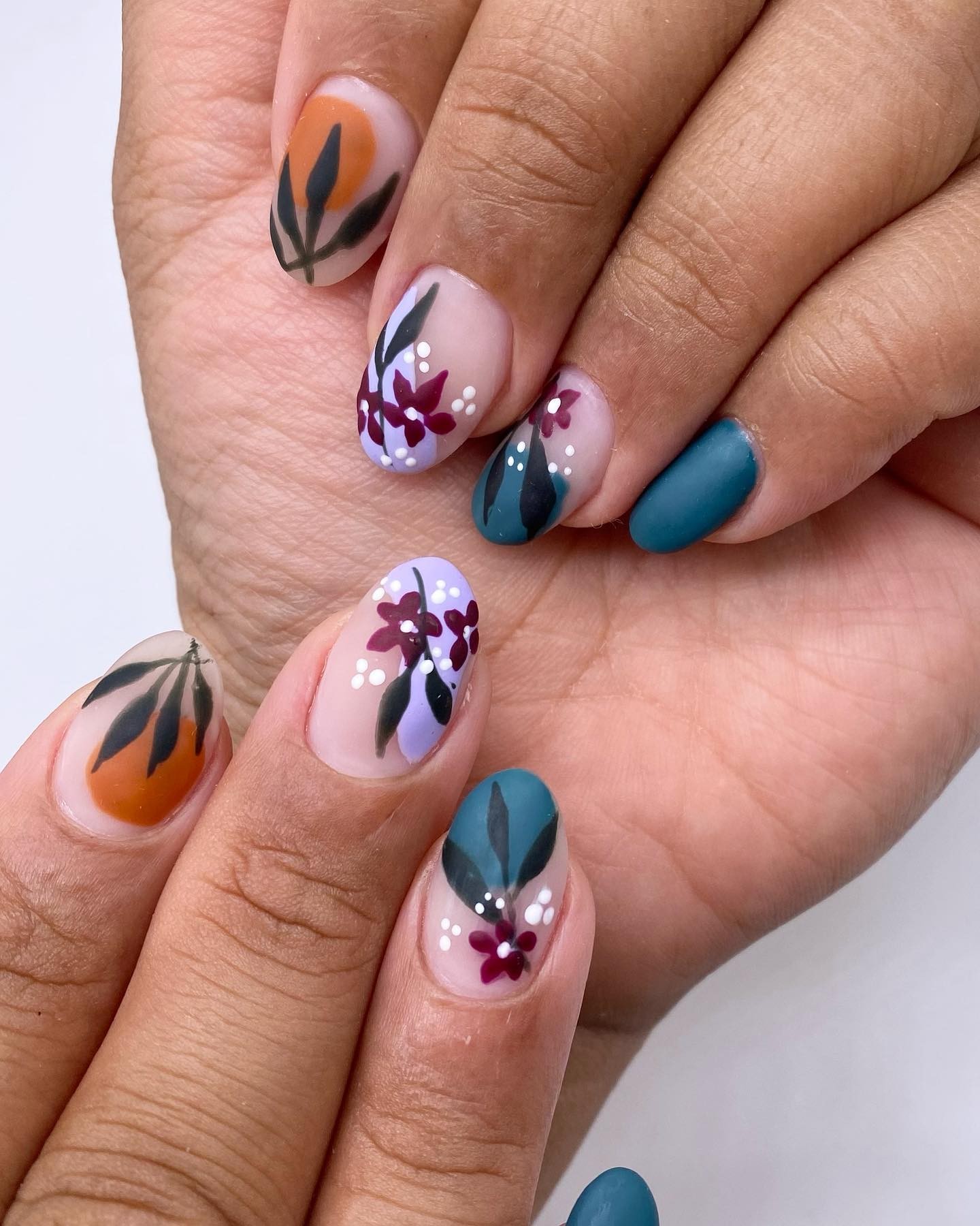 Colorful Floral Patterns on Matte Nails