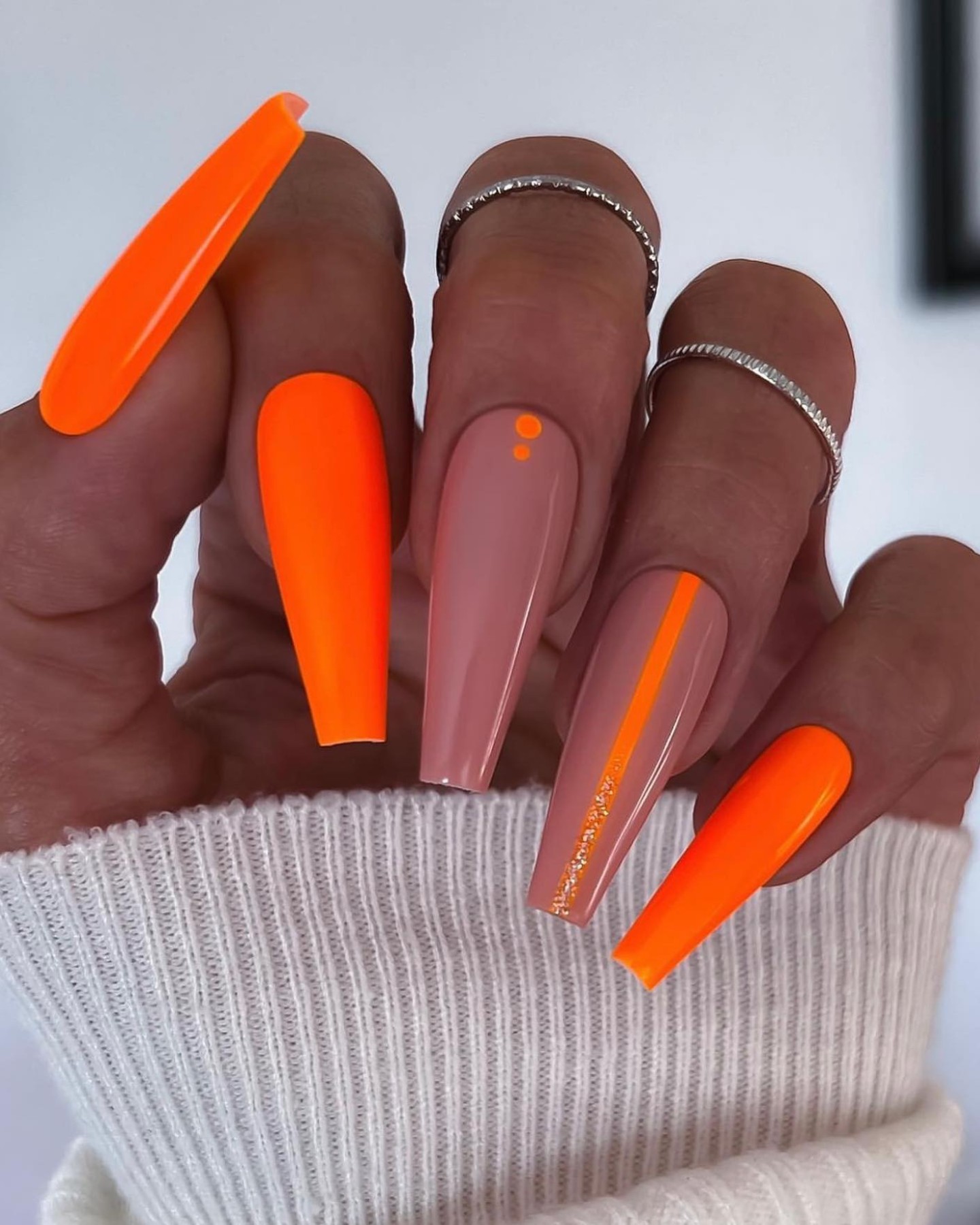 The Minimalist’s Statement in Orange and Nude