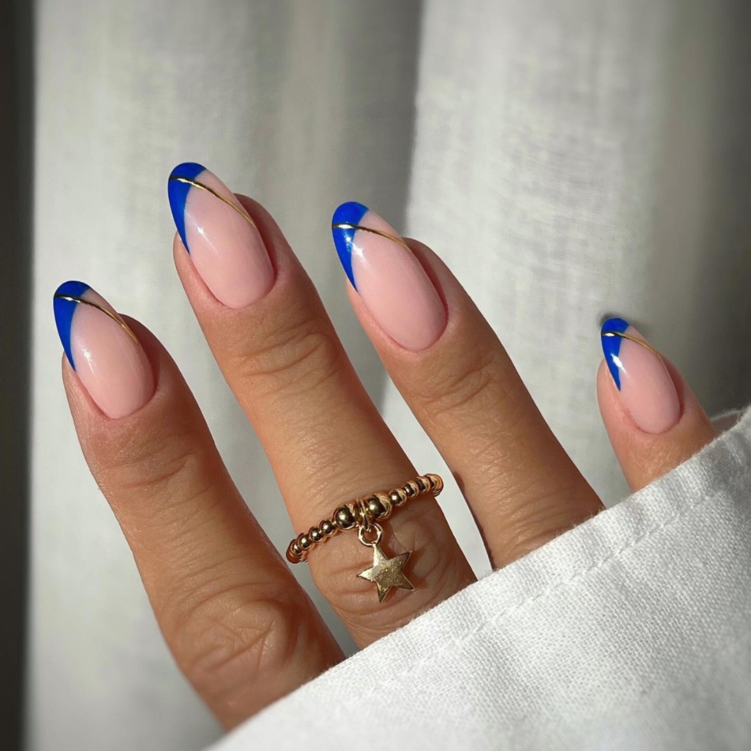 Classic French Tip with a Blue Blossom