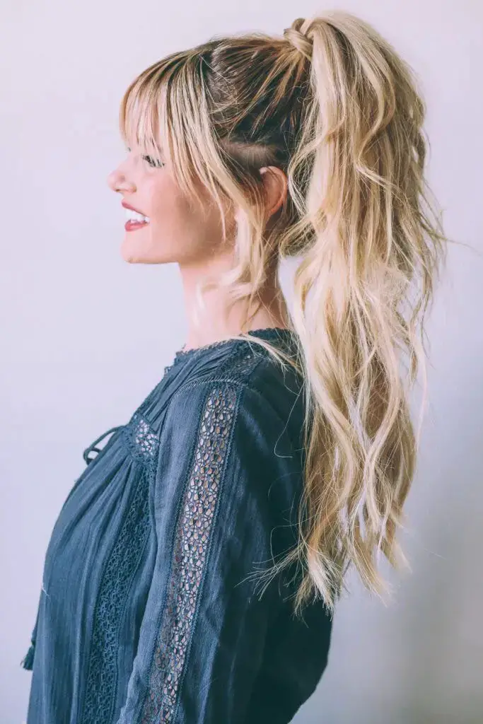 High Textured Ponytail with Long Curtain Bangs