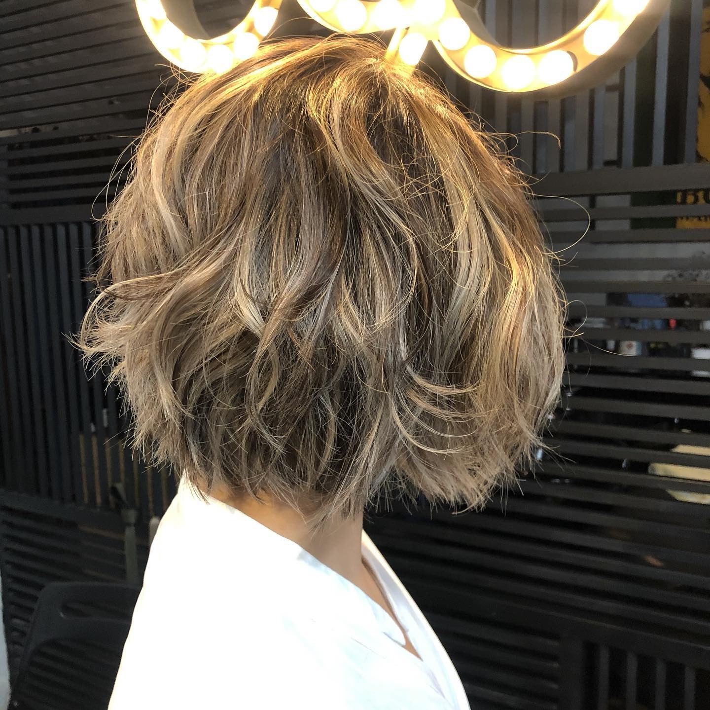 The Sunrise Glow: Warm Toned Wavy Bob