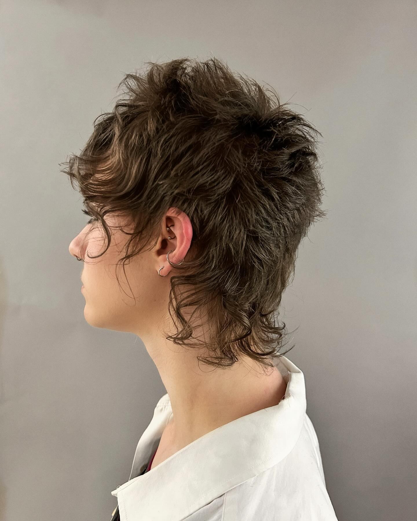 The Whimsical Wisp: Curly Bangs and Playful Spirals