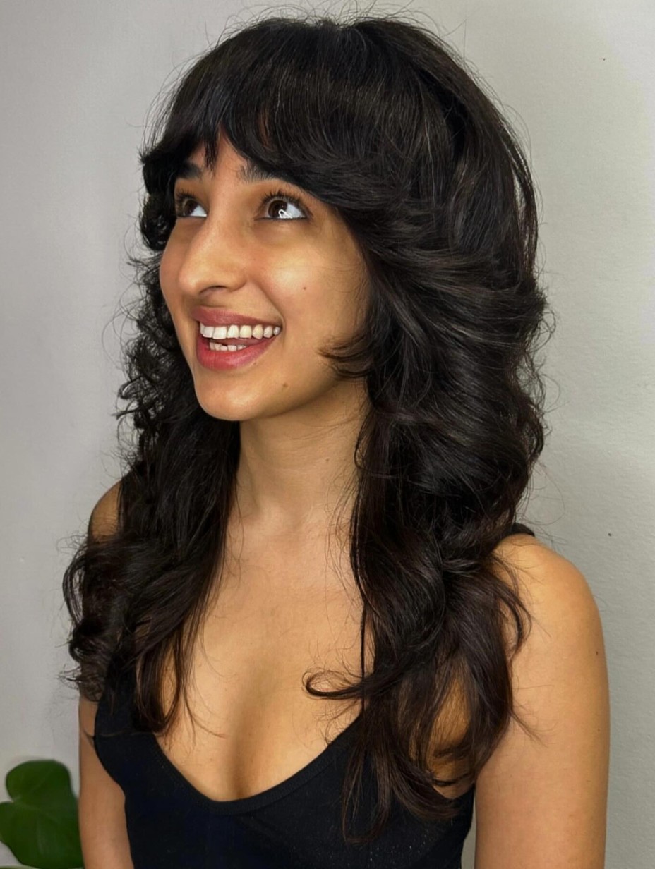 Playful and Free: Curly Medium Shag with Bangs