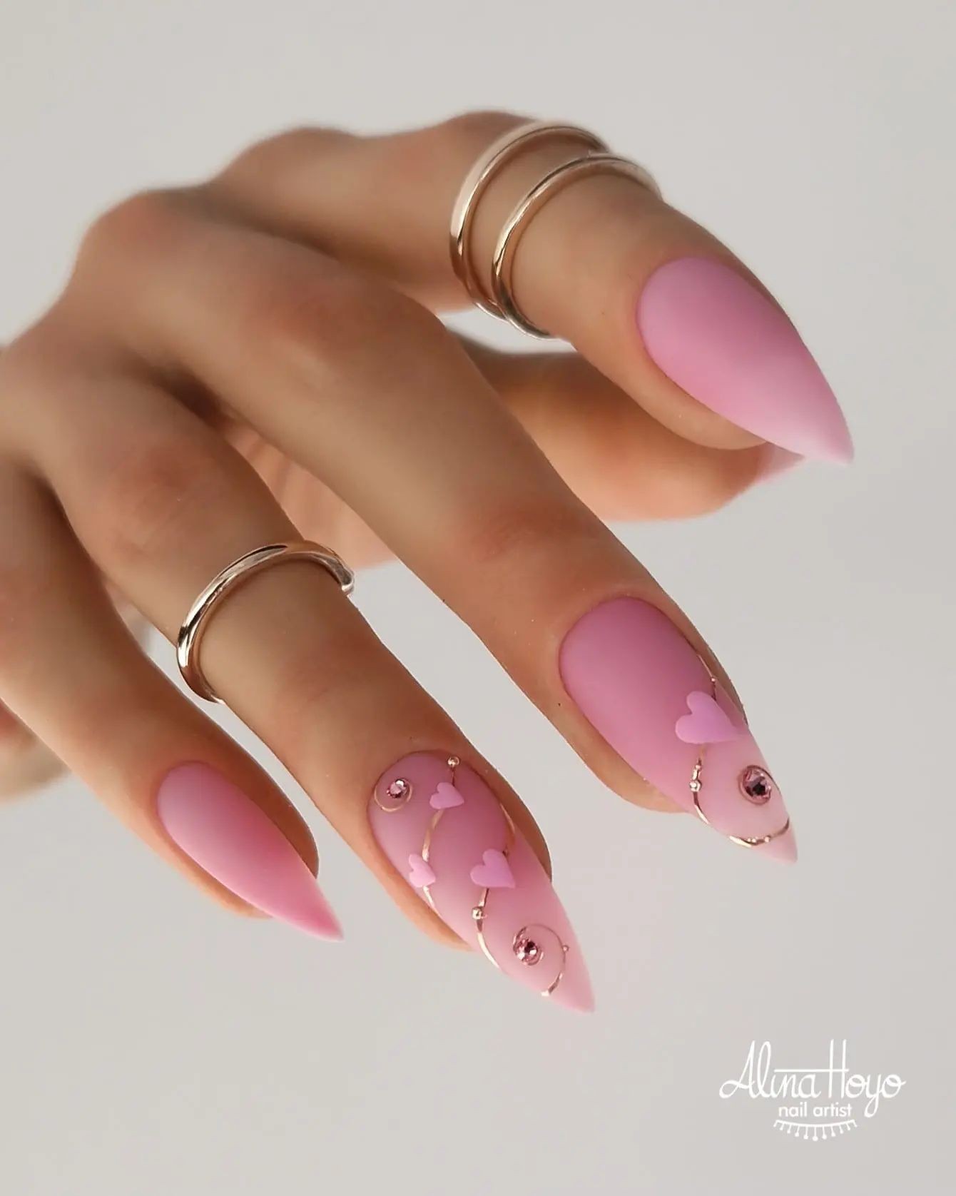 Romantic Pink Almond Nails with Embellishments