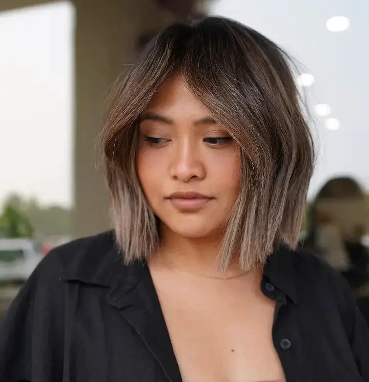 The Edgy Sophistication of a Sun-Kissed Angled Bob