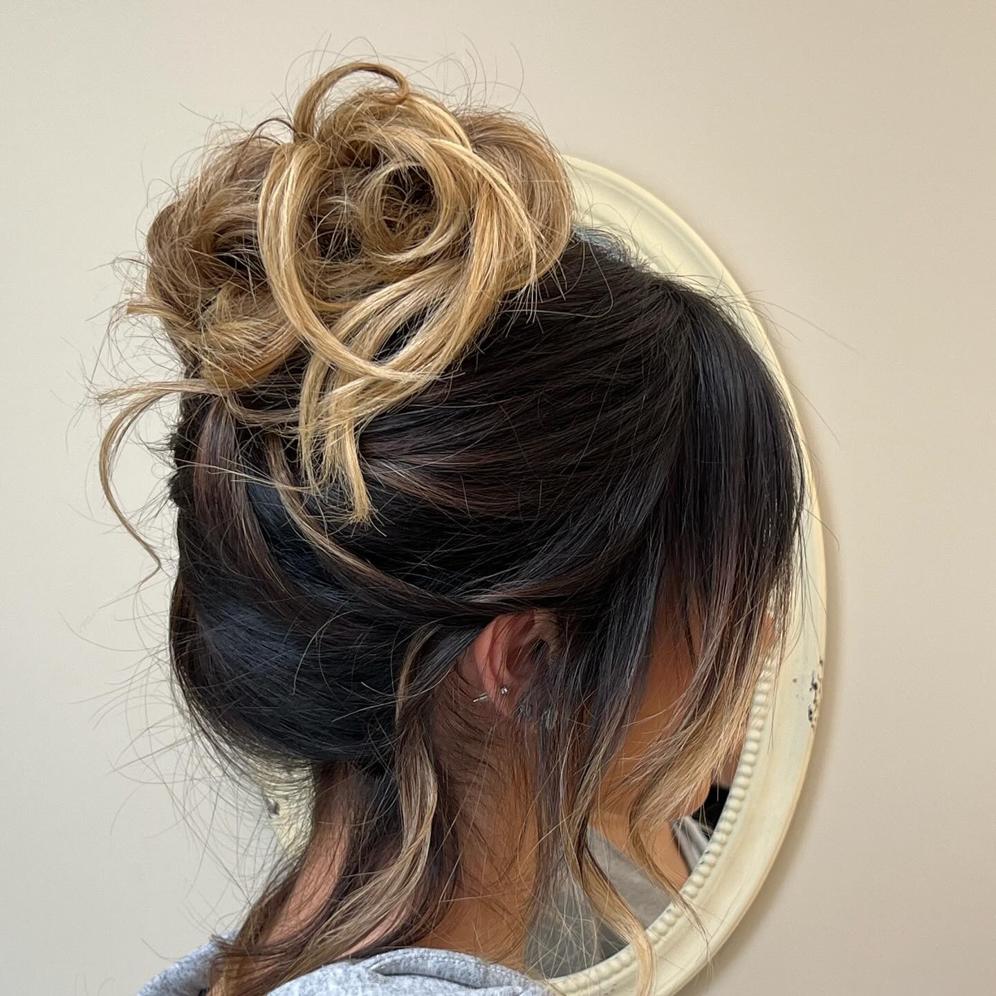 Messy High Bun with Highlights