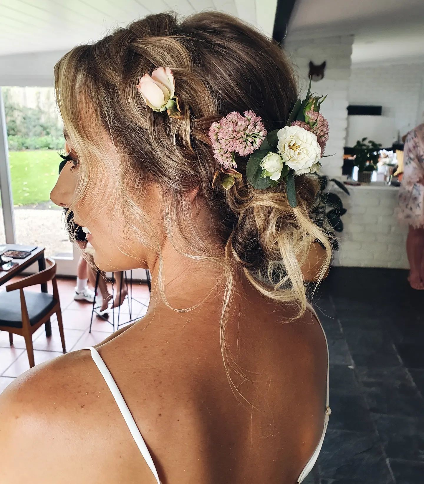 Romantic Loose Bun with Pastel Flowers